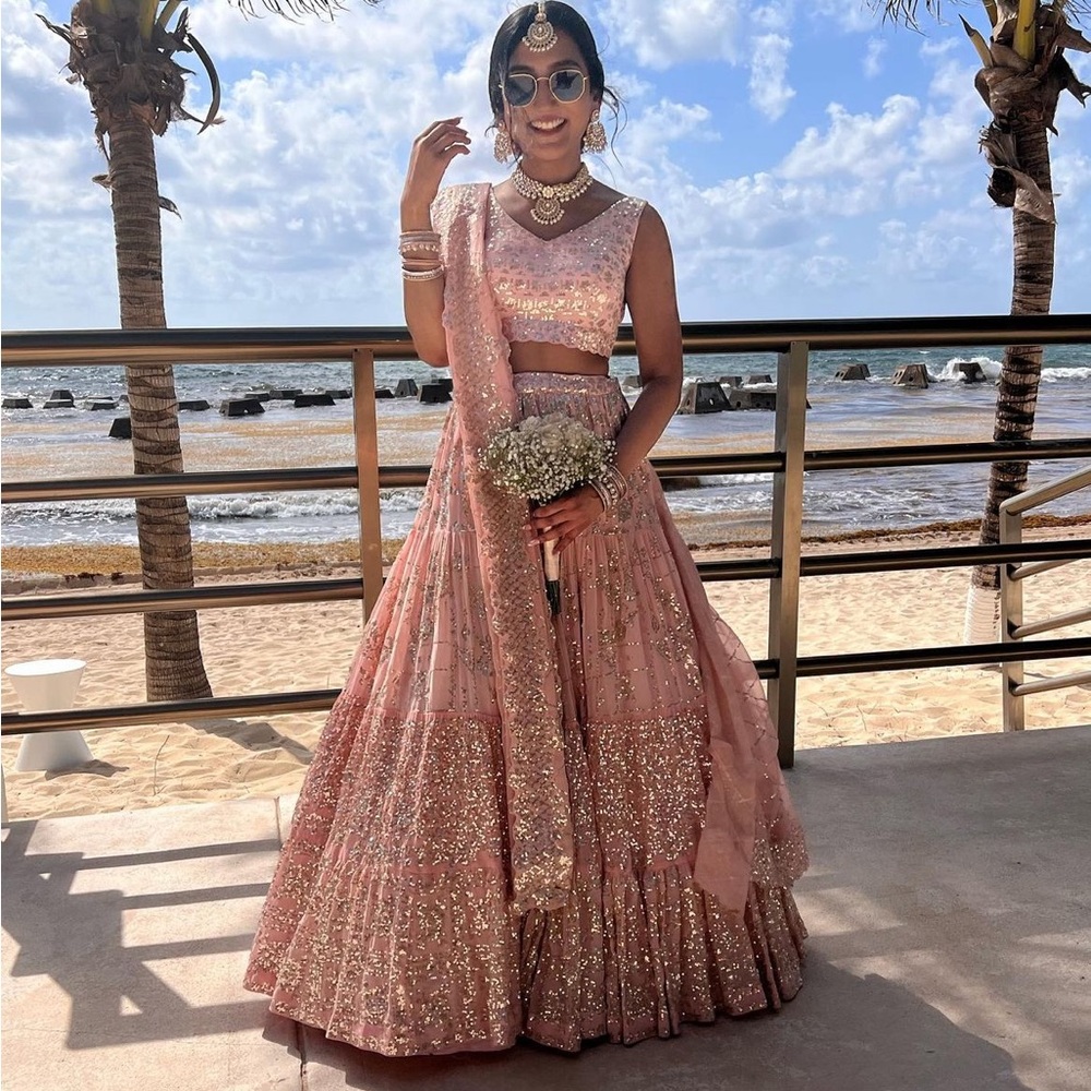 Seema Gujral peach multi-tiered sequin lehnga